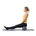 Woman, foam and roller on mat for yoga, exercise or fitness workout in studio on white background. Pilates, profile or