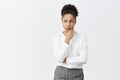 Woman focused on mind, thinking what choice make. Thoughtful good-looking smart and creative manager in white shirt and