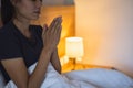 A woman folded her hands, praying for blessings and praying to God. Praying for spiritual beliefs. The power of hope or love and Royalty Free Stock Photo