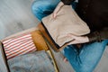 Woman packing clothes into cardboard donation box Royalty Free Stock Photo