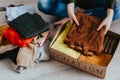 Woman packing clothes into cardboard donation box Royalty Free Stock Photo