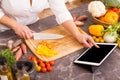 Woman following the recipe in tablet