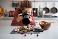 Woman food photographer taking closeup of mushrooms Royalty Free Stock Photo