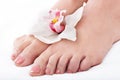 Woman foot with flower lily. Royalty Free Stock Photo