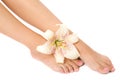 Woman foot with lily flower Royalty Free Stock Photo