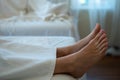 Woman foot on the massage bed. Sleeping rest relaxation in spa room with copy space Royalty Free Stock Photo