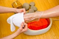 Woman foot in paraffin bath at the spa Royalty Free Stock Photo