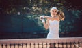 Woman forcefully playing tennis in court Royalty Free Stock Photo