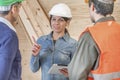 Woman foreman instructing layman