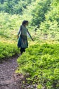 woman on a forest path Royalty Free Stock Photo