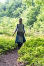 woman on a forest path Royalty Free Stock Photo