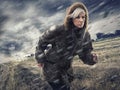 Woman, forest and running in storm weather, nature and survival or safety for climate change. Athlete, warm jacket or Royalty Free Stock Photo