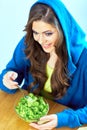 Woman with fork eating lettuche. Royalty Free Stock Photo