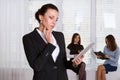 Woman in formal clothes pensively reads the information from the