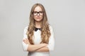 Woman in formal wear crossed hands, toothy smiling and looking a Royalty Free Stock Photo