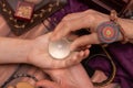 Woman fortune teller holds a ball of fate in her hands, a magic ball of predictions. The concept of predicting the future, magic,