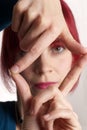 Woman framing face with fingers Royalty Free Stock Photo