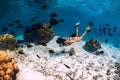 Woman freediver swimming over with yellow fins in ocean. Freediving or snorkeling in Mauritius