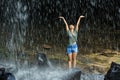Woman freedom under waterfall Royalty Free Stock Photo