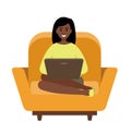 Woman freelancer African American with a laptop sitting on a sofa