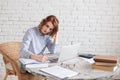 Woman freelancer female hands with pen writing on notebook at home or office Royalty Free Stock Photo