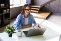 Young woman freelancer female hands with pen writing on notebook at home or office Royalty Free Stock Photo