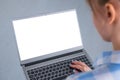 Woman freelancer typing on laptop computer keyboard with white blank screen Royalty Free Stock Photo