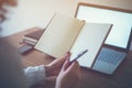 Woman freelancer working at home telework taking notes. Royalty Free Stock Photo