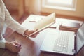 Woman freelancer working at home telework taking notes. Royalty Free Stock Photo