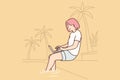 Woman freelancer working with laptop sitting on beach under palm tree or near pool in resort hotel