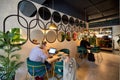 ROME, ITALY - APRIL 09 2022: Woman freelancer works on laptop sitting at table in cafe