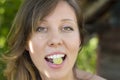 Woman with fresh grape in her mouth Royalty Free Stock Photo