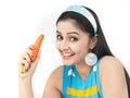 Woman with a fresh orange carrot Royalty Free Stock Photo