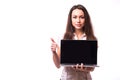 Woman with friendly happy smile holding a laptop computer and pointing at screen Royalty Free Stock Photo