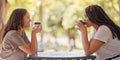 Woman, friends and drinking coffee at cafe for conversation, social life or communication outside. Happy women enjoying Royalty Free Stock Photo