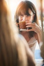 Woman, friends and drinking coffee for conversation, chatting about social life or gossip at an outdoor cafe. Happy Royalty Free Stock Photo