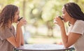 Woman, friends and drinking coffee on table at cafe in social life, catchup or communication outside. Happy women Royalty Free Stock Photo