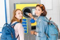 friends together at the reverse vending machine recycle plastic bottles, ecology concept