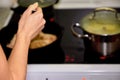 Frying chicken in a pan. Cooking potatoes Royalty Free Stock Photo