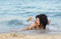 Woman frolicking in the surf