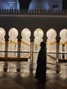 The woman in front of the Abu Dhabi Grand Mosque