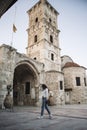 Woman in front of ancient tower of St.Lazarus church in Larnaca Royalty Free Stock Photo