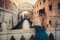 Woman in front of Bridge of Sighs in Venice Royalty Free Stock Photo