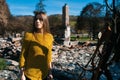 Woman in front of her burned home after fire disaster Royalty Free Stock Photo