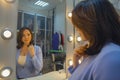 Woman in front of a mirror in the dressing room Royalty Free Stock Photo