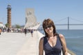 Woman in front of the monument to the discoverers in Lisbon, Portugal