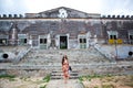 Woman in front of old-fashioned house Royalty Free Stock Photo