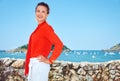 Woman in front of scenery overlooking lagoon with yachts Royalty Free Stock Photo