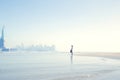 Woman in front of the statue of liberty dreams of a new life