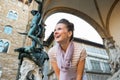 Woman in front of statue perseus in florence